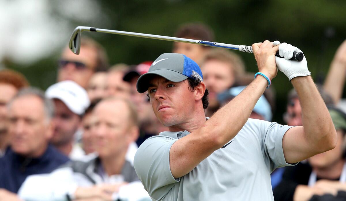 Rory McIlroy watches his approach shot at No. 17 on Saturday during the third round of the British Open at Royal Liverpool in Hoylake, England.