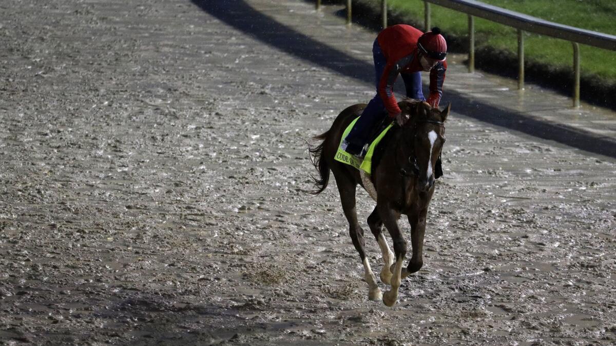 Code of Honor goes for a morning workout run at Churchill Downs on May 3.