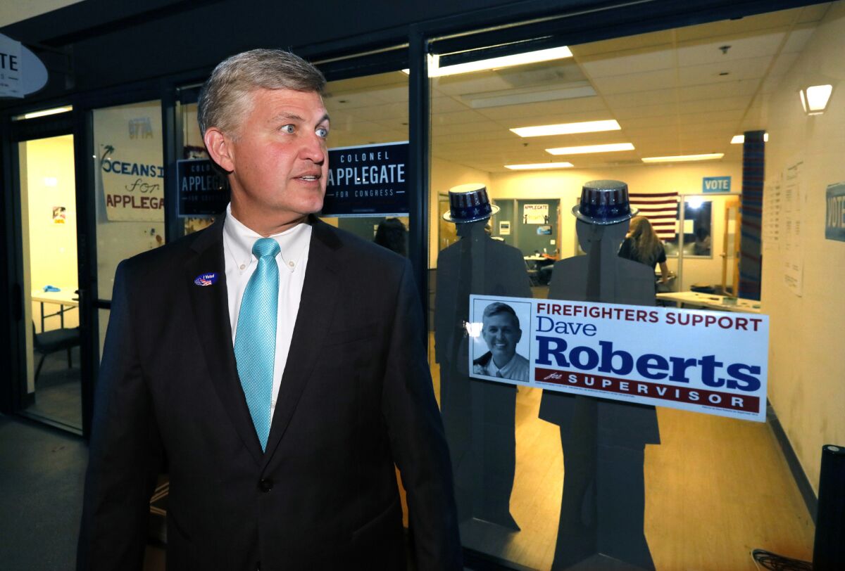 Dave Roberts visits and stands on front of his Solana Beach campaign headquarters after thanking volunteer inside on the phones.