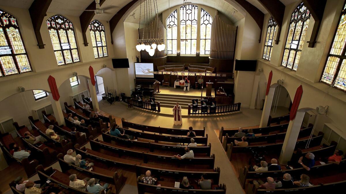 The Rev. Ruth Marsh leads Sunday services at Trinity United Methodist Church in Idaho Falls. The church plans to sell meals and rent spaces in its parking lot to people coming to the city to view next week's solar eclipse.