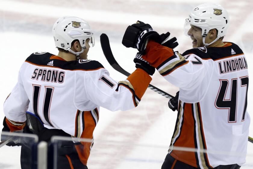 Anaheim Ducks forward Daniel Sprong, left, of the Netherlands, and teammate defenseman Hampus Lindholm, of Sweden, celebrate Sprong's winning overtime goal against the Columbus Blue Jackets during an NHL hockey game in Columbus, Ohio, Saturday, Dec. 15, 2018. (AP Photo/Paul Vernon)