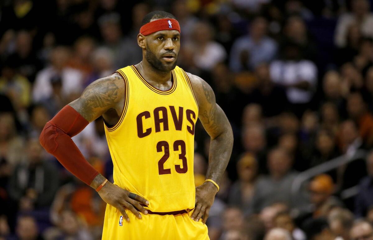 Cleveland Cavaliers forward LeBron James looks on during the first half of a game Tuesday against the Phoenix Suns.