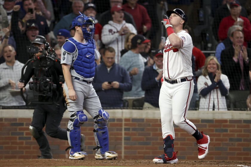 Atlanta Braves' Joc Pederson celebrates while crossing home off a two-run home run in Game 2 of the 2021 NLCS