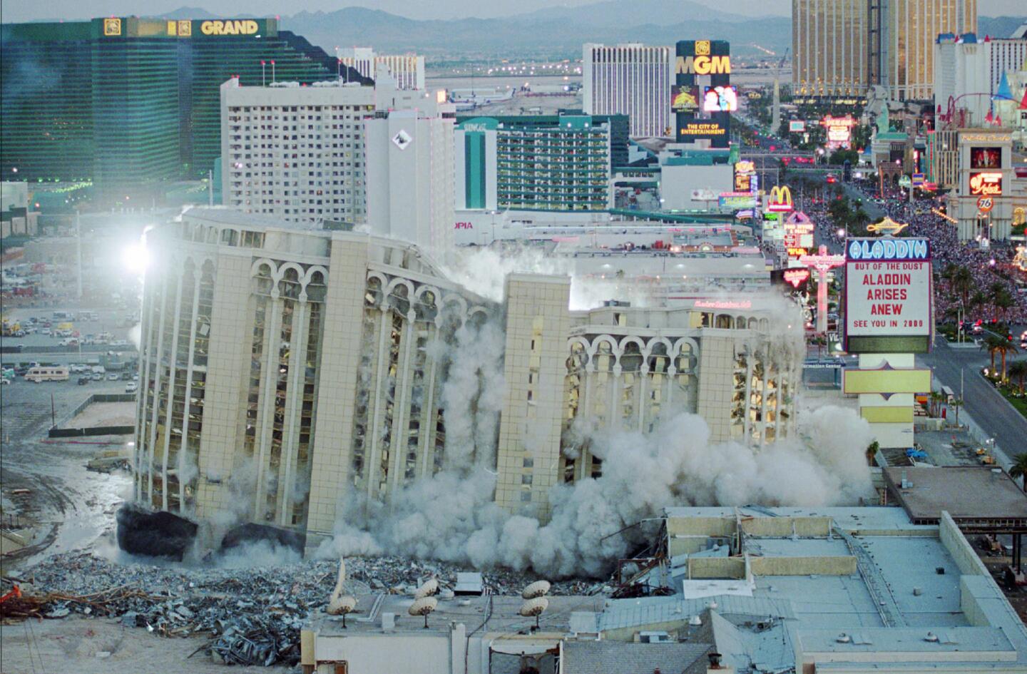 The Aladdin Hotel & Casino comes tumbling down as it is imploded, April 27, 1998, in Las Vegas. The Aladdin was built in 1966.