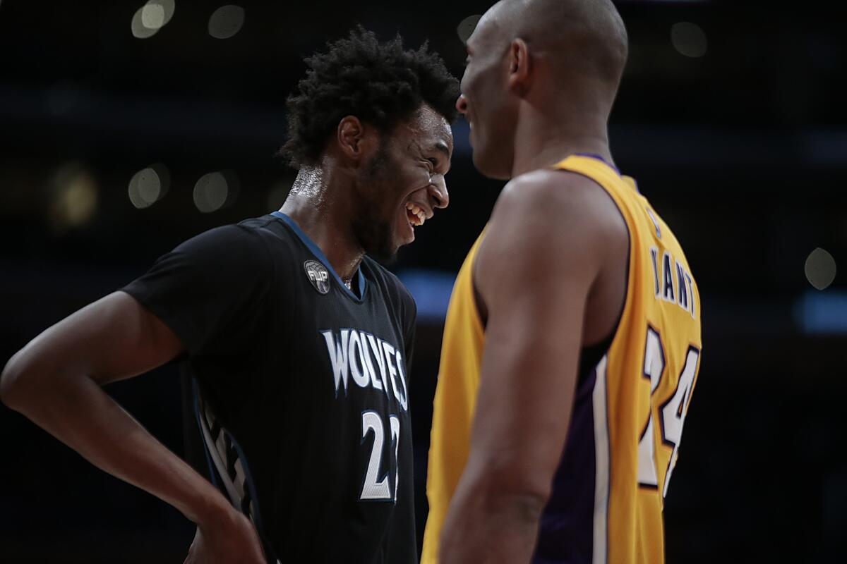 Kobe Bryant and Timberwolves guard Andrew Wiggins share a laugh during a break in a Feb. 2 game at Staples Center.