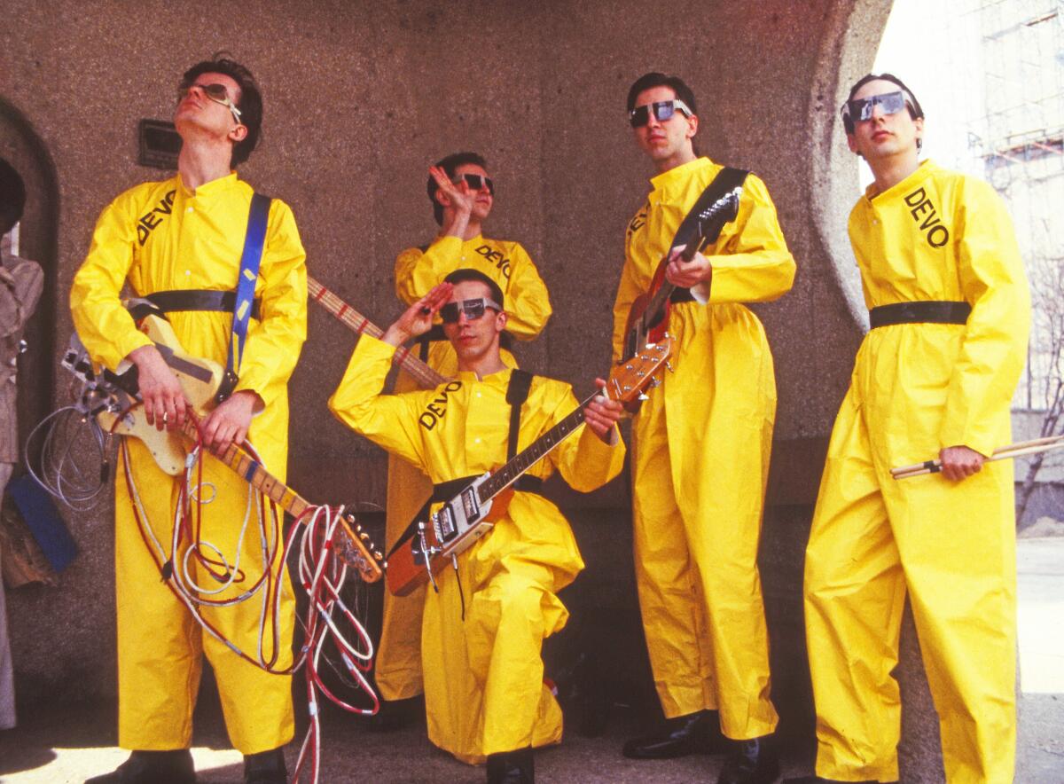 A band dressed in yellow jumpsuits alters the future of pop music.