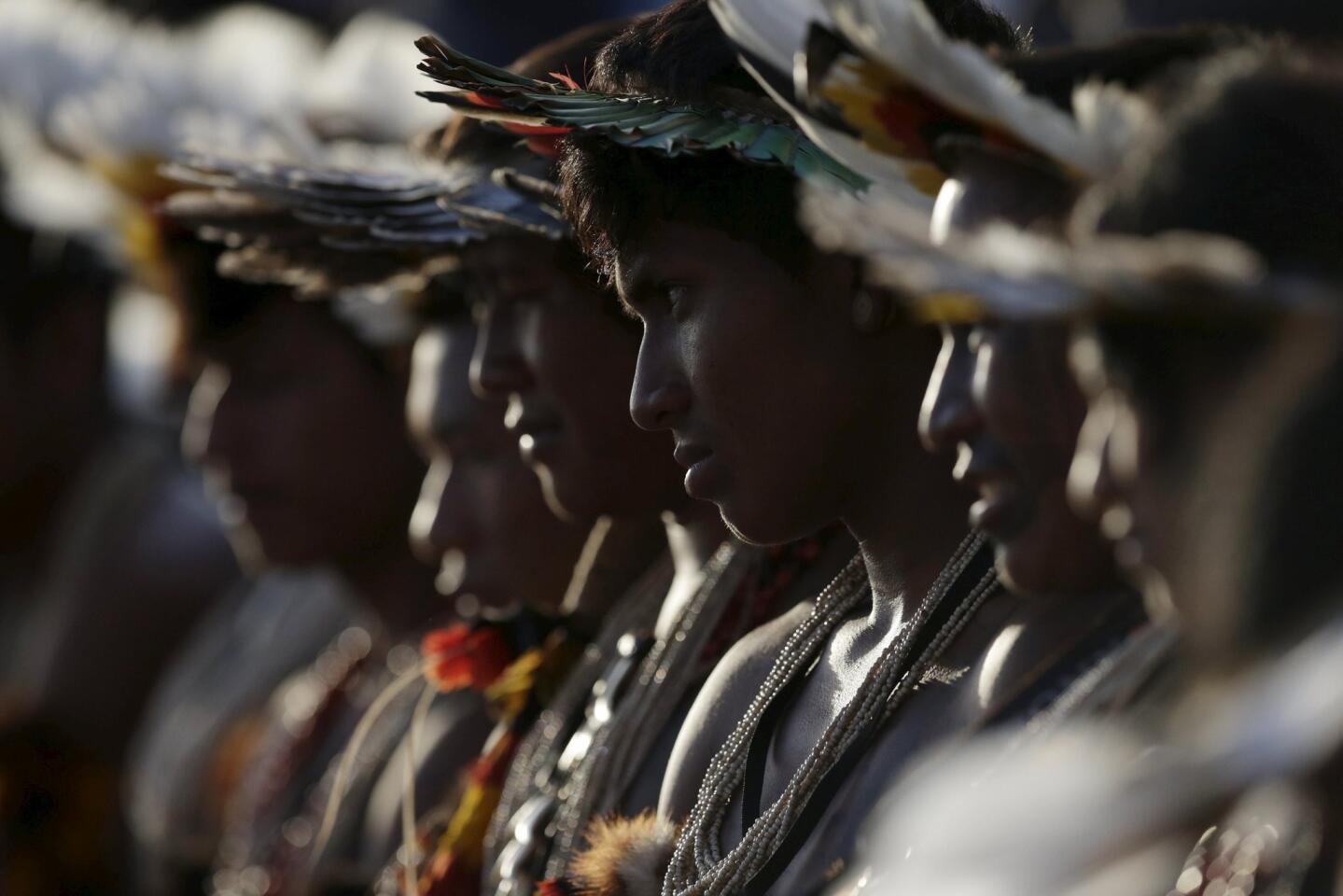 Indigenous men from the Erikbaktsa tribe watch the bow-and-arrow competition at the first World Games for Indigenous Peoples in Palmas
