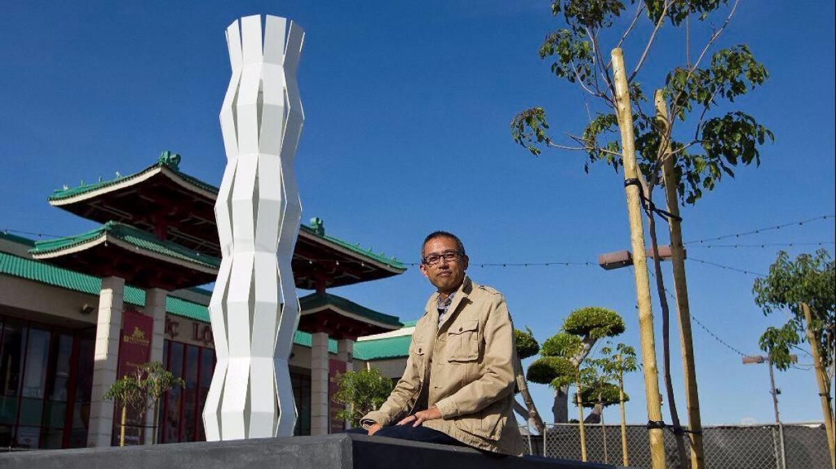 James Dinh, an artist based in Cerritos, created the sculpture "Of Two Lineages" as the centerpiece of the public art project "Courage to Rebuild" at the Asian Garden Mall in Westminster. The project commemorates the 40th anniversary of Vietnamese migration to the United States.