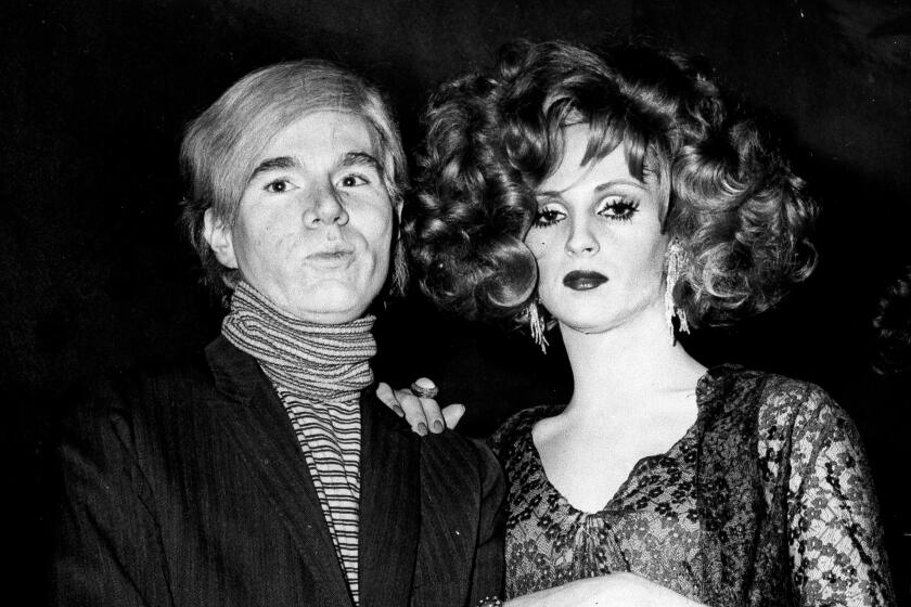 Underground filmmaker and artist Andy Warhol, left, is seen with one of his superstars, Candy Darling in 1969.