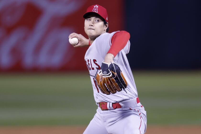 Los Angeles Angels' Shohei Ohtani throws against the Oakland Athletics in the second inning.