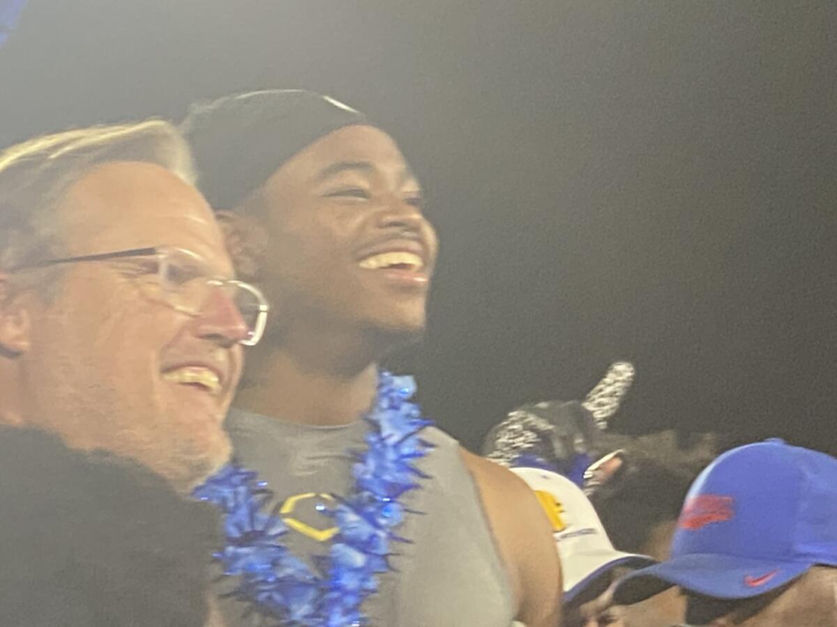 Gardena Serra coach Scott Altenberg (left) and quarterback Maalik Murphy.