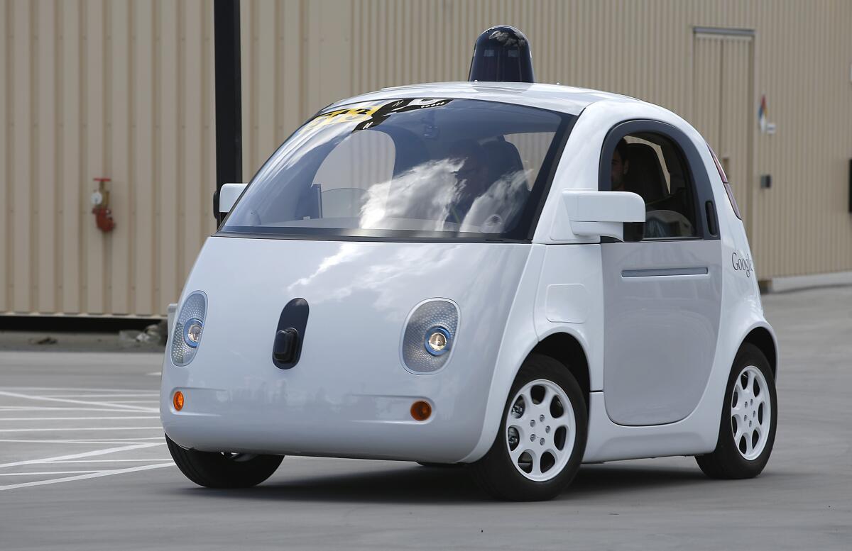 Google's self-driving prototype car drives around a parking lot during a demonstration at the Google campus in Mountain View, Calif., last year.