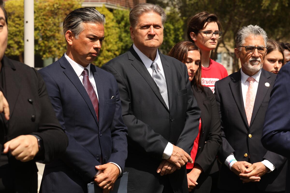 California Atty. Gen. Rob Bonta stands next to state Sen. Bob Hertzberg and State Sen. Anthony Portantino.