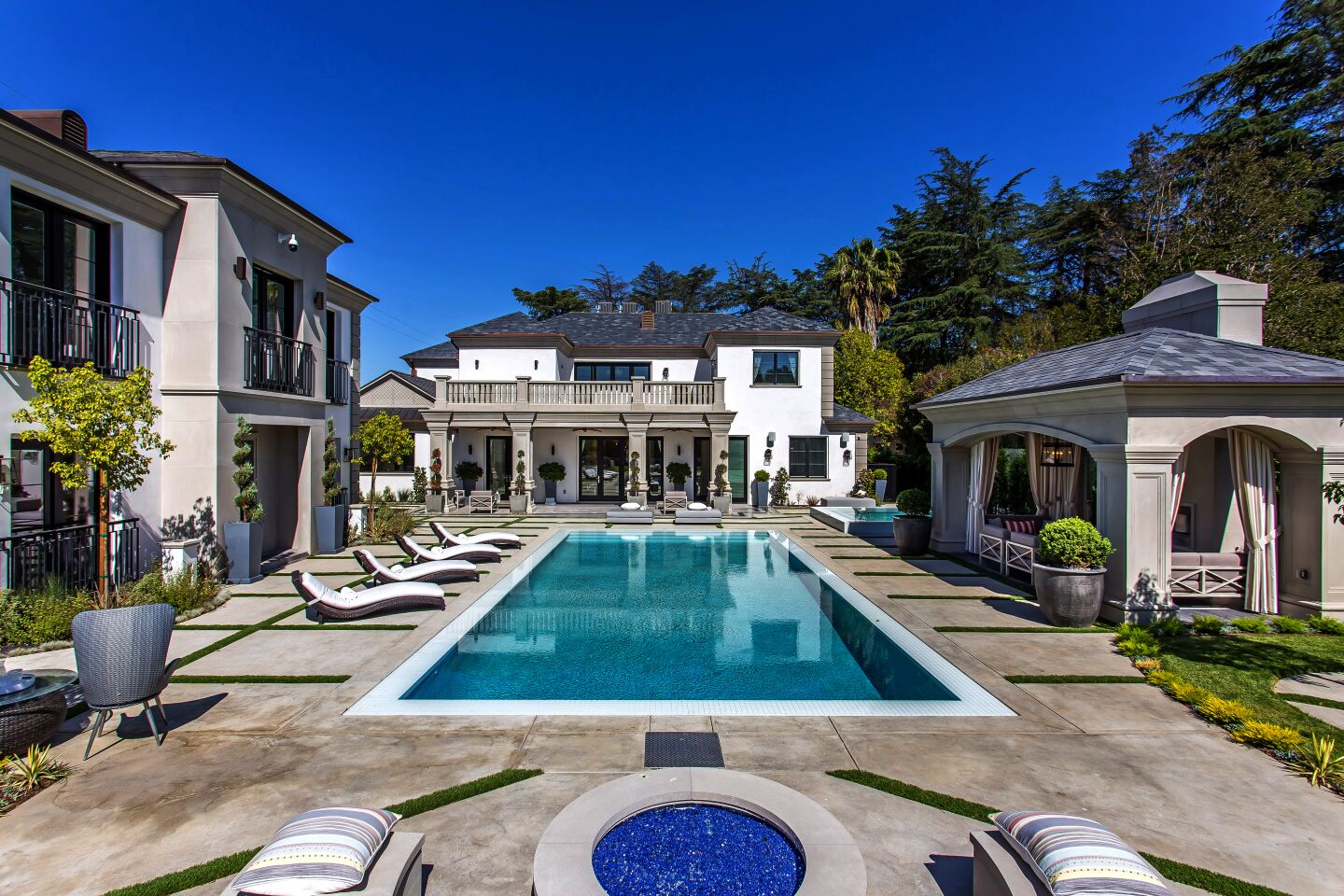 Grammy-winning producer Philip Lawrence shelled out $10.55 million for the Encino home of former Dodger Jimmy Rollins. The neoclassical-inspired home sits behind gates on more than half an acre with a sports court, a resort-style swimming pool and a guesthouse. A wine cellar, an indoor sauna and a grand domed entry are among features of the 14,900-square-foot mansion, which was built in 2017.