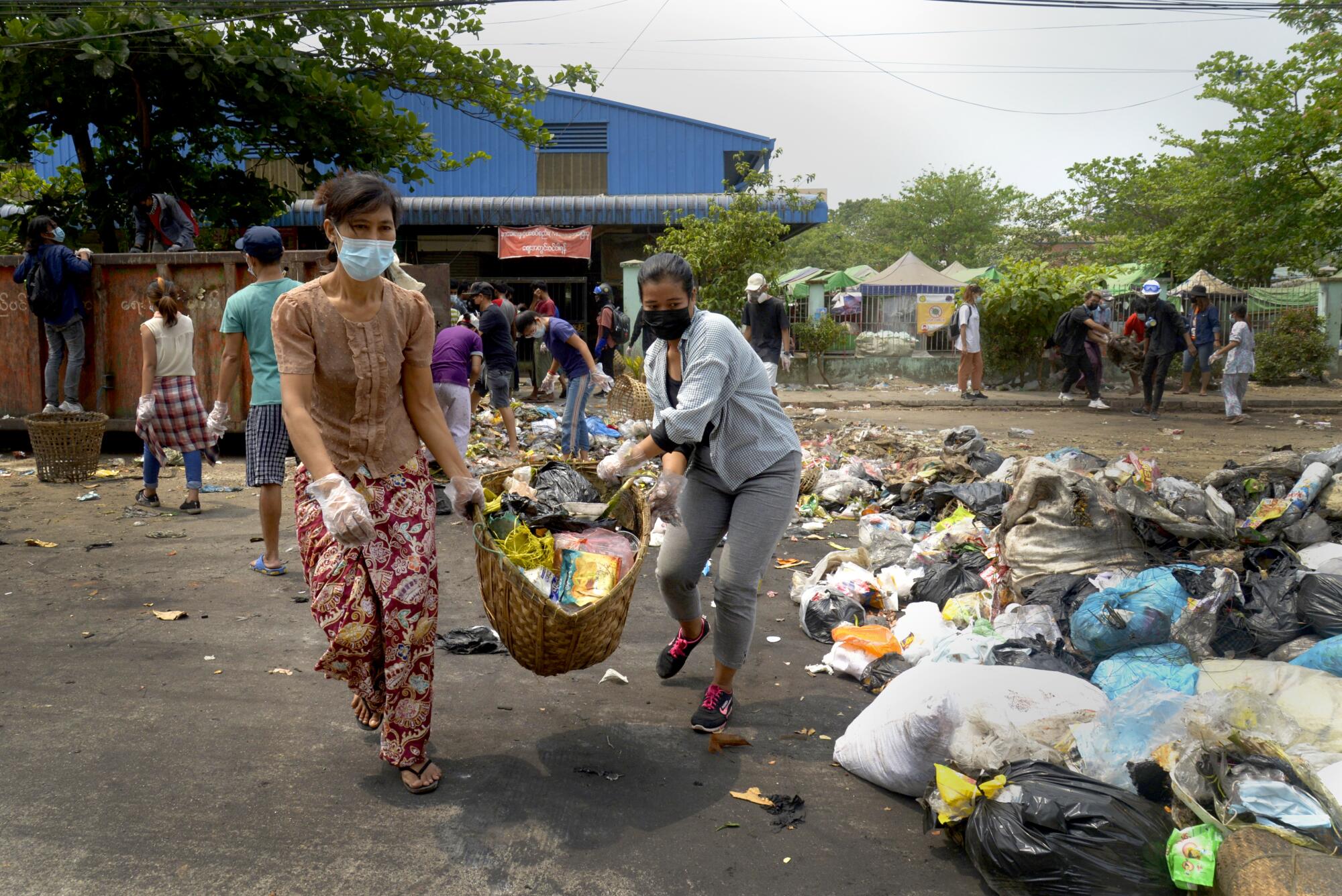 Protesters use garbage to block road