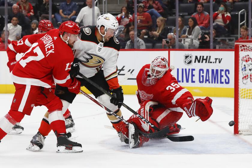 Anaheim Ducks left wing Nick Ritchie (37) scores on Detroit Red Wings goaltender Jimmy Howard (35) as defenseman Filip Hronek (17) defends in the third period of an NHL hockey game, Tuesday, Oct. 8, 2019, in Detroit. (AP Photo/Paul Sancya)