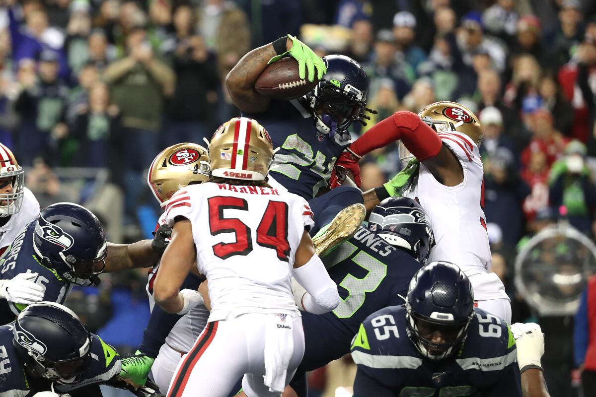 Seattle Seahawks running back Marshawn Lynch scores a one-yard touchdown against the San Francisco 49ers in the fourth quarter.