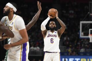 Los Angeles Lakers forward LeBron James (6) looks to pass against the Detroit Pistons during the first half of an NBA basketball game, Sunday, Dec. 11, 2022, in Detroit. (AP Photo/Jose Juarez)