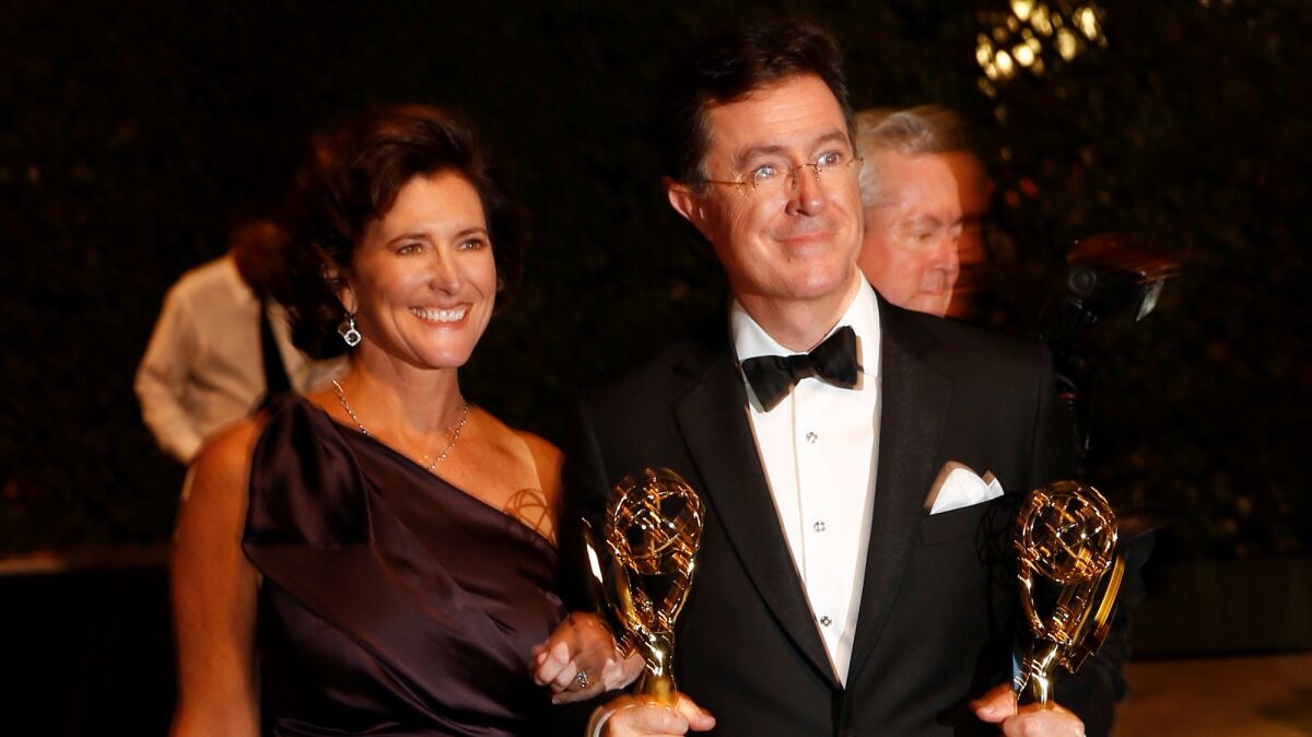 Stephen Colbert with his wife, Evelyn McGee-Colbert, after he won two Emmys in 2013.