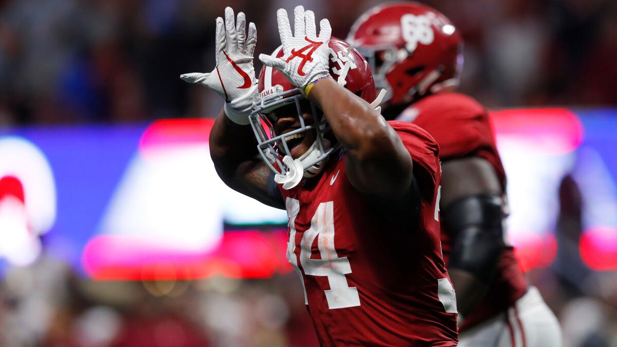 Alabama's Damien Harris celebrates after scoring a touchdown against Florida State during the third quarter Saturday.