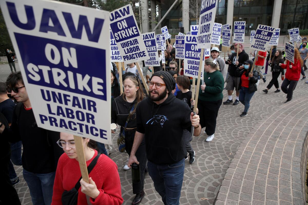 Striking academic workers walk the picket line at UCLA on Nov. 28.