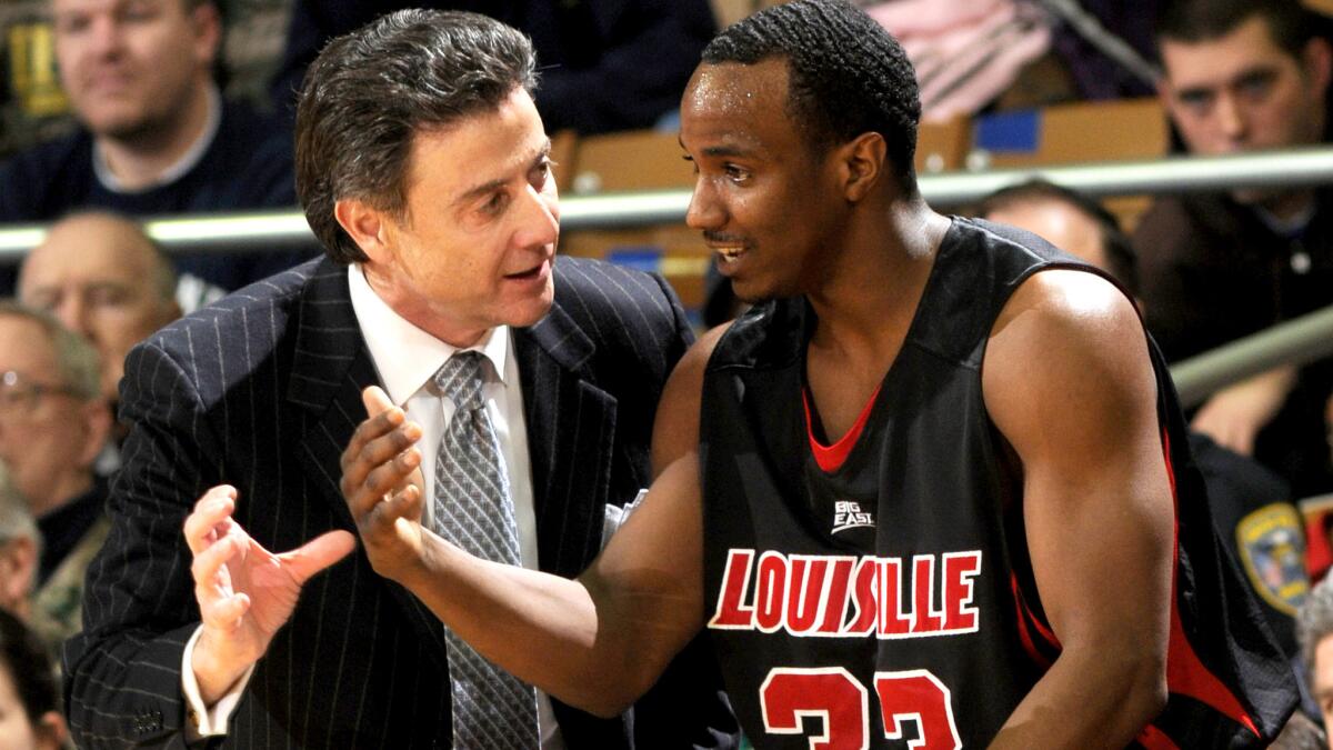 Louisville Coach Rick Pitino talks to guard Andre McGee during a game against Notre Dame last season.
