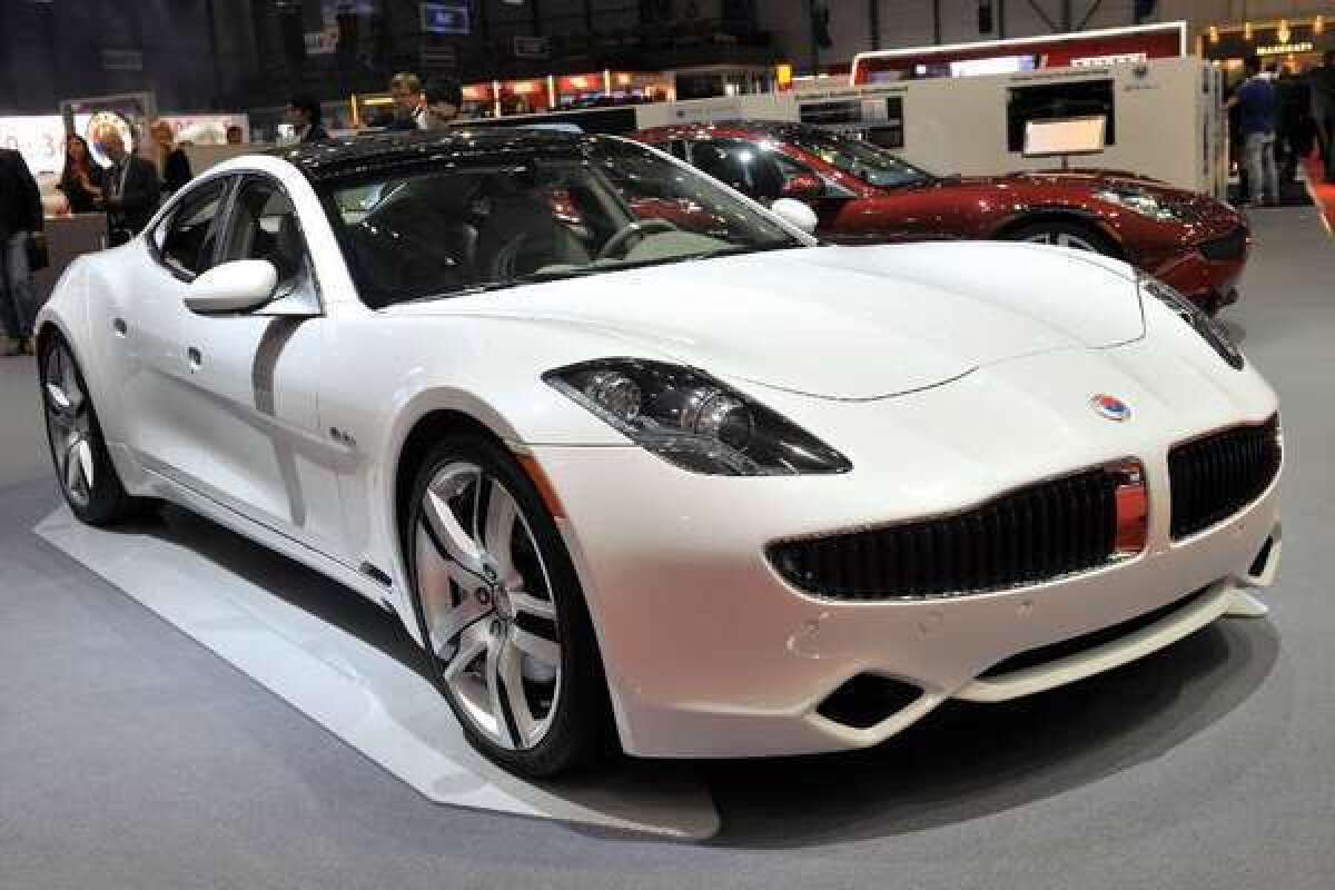 A Fisker Karma hybrid car is displayed at the U.S. automaker's booth at the 2012 Geneva Motor Show in Geneva. With the company's woes continuing, owners are trying to sell their cars.