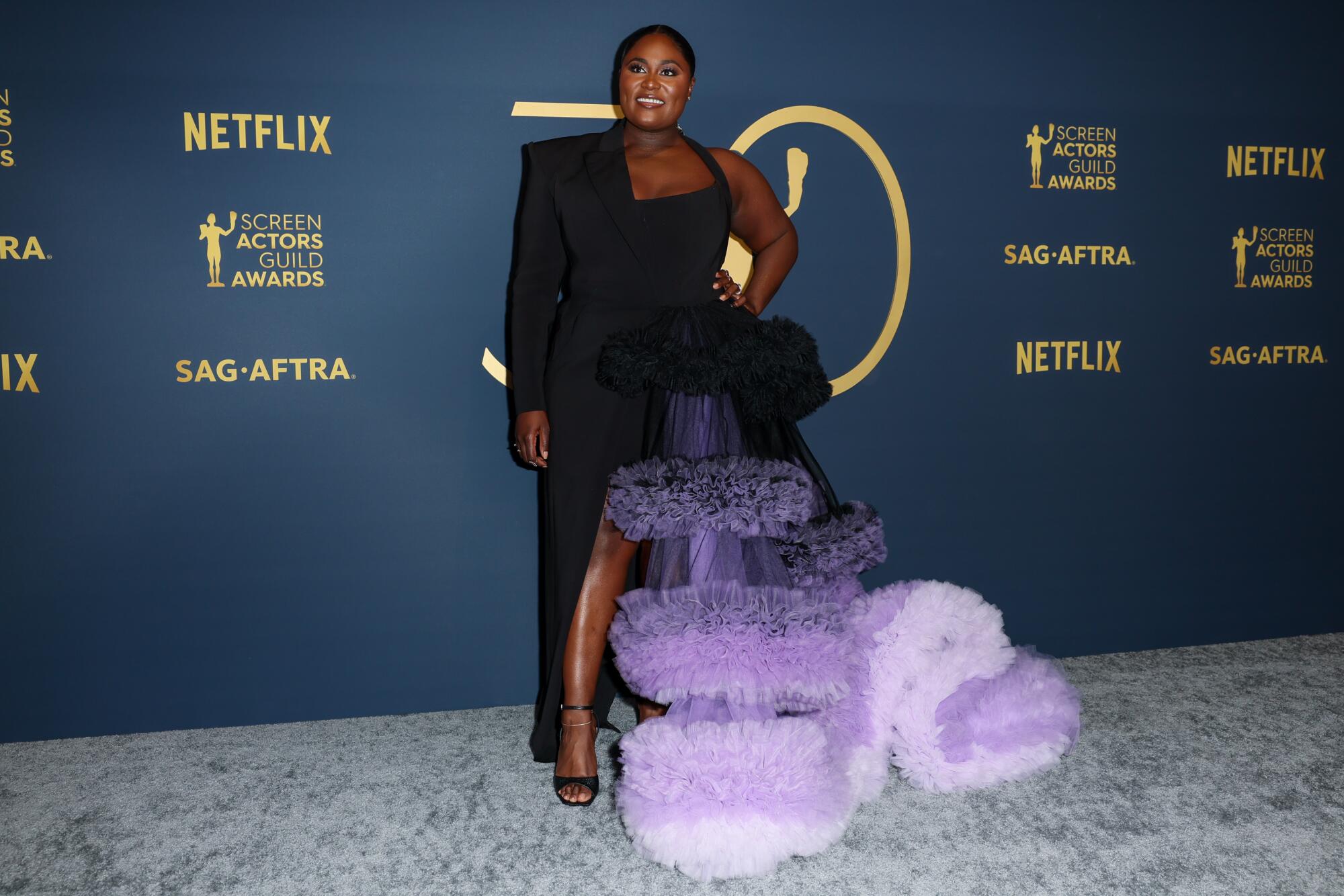 Danielle Brooks wears a half-suit/half-gown at the SAG Awards. 