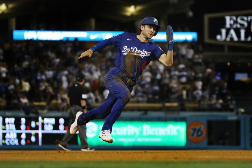 LOS ANGELES, CA - AUGUST 20, 2021: Los Angeles Dodgers second baseman Trea Turner (6) speeds around the bases to score from first base on an RBI double by Los Angeles Dodgers first baseman Max Muncy (13) against the New York Mets in the third inning at Dodger Stadium on August 20, 2021 in Los Angeles, California.(Gina Ferazzi / Los Angeles Times)