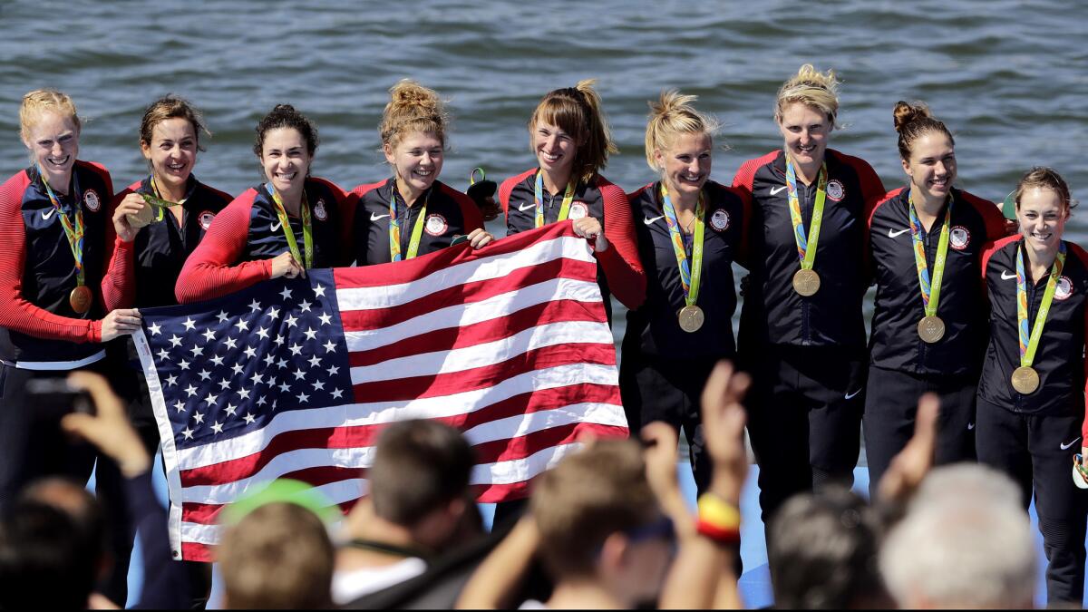 The U.S. women's eight crew, from left, Emily Regan, Kerry Simmonds, Amanda Polk, Lauren Schmetterling, Tessa Gobbo, Meghan Musnicki, Eleanor Logan, Amanda Elmore and Katelin Snyder -- celebrate after receiving their gold medals.