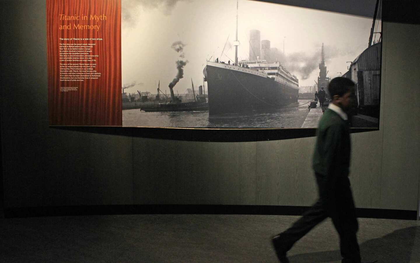 A schoolboy walks past a Titanic display at the Ulster Folk & Transport Museum in Belfast, Northern Ireland. Two exhibitions at the museum focus on the construction and the human side of the saga of the famed ocean liner, which hit an iceberg and sank on its maiden voyage in 1912.