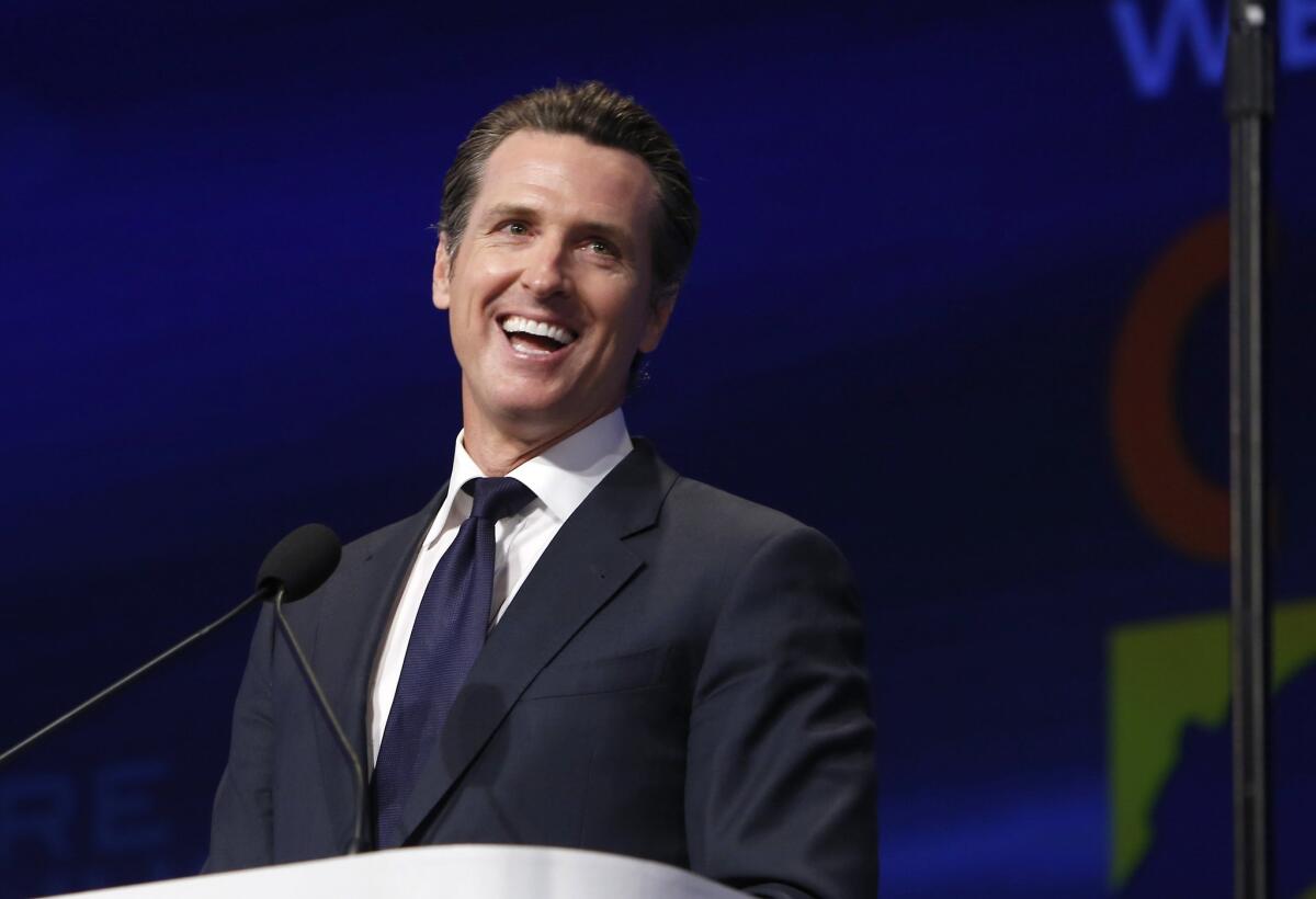 Lt. Gov. Gavin Newsom laughs during his speech at the 2013 Democratic State Convention in Sacramento.