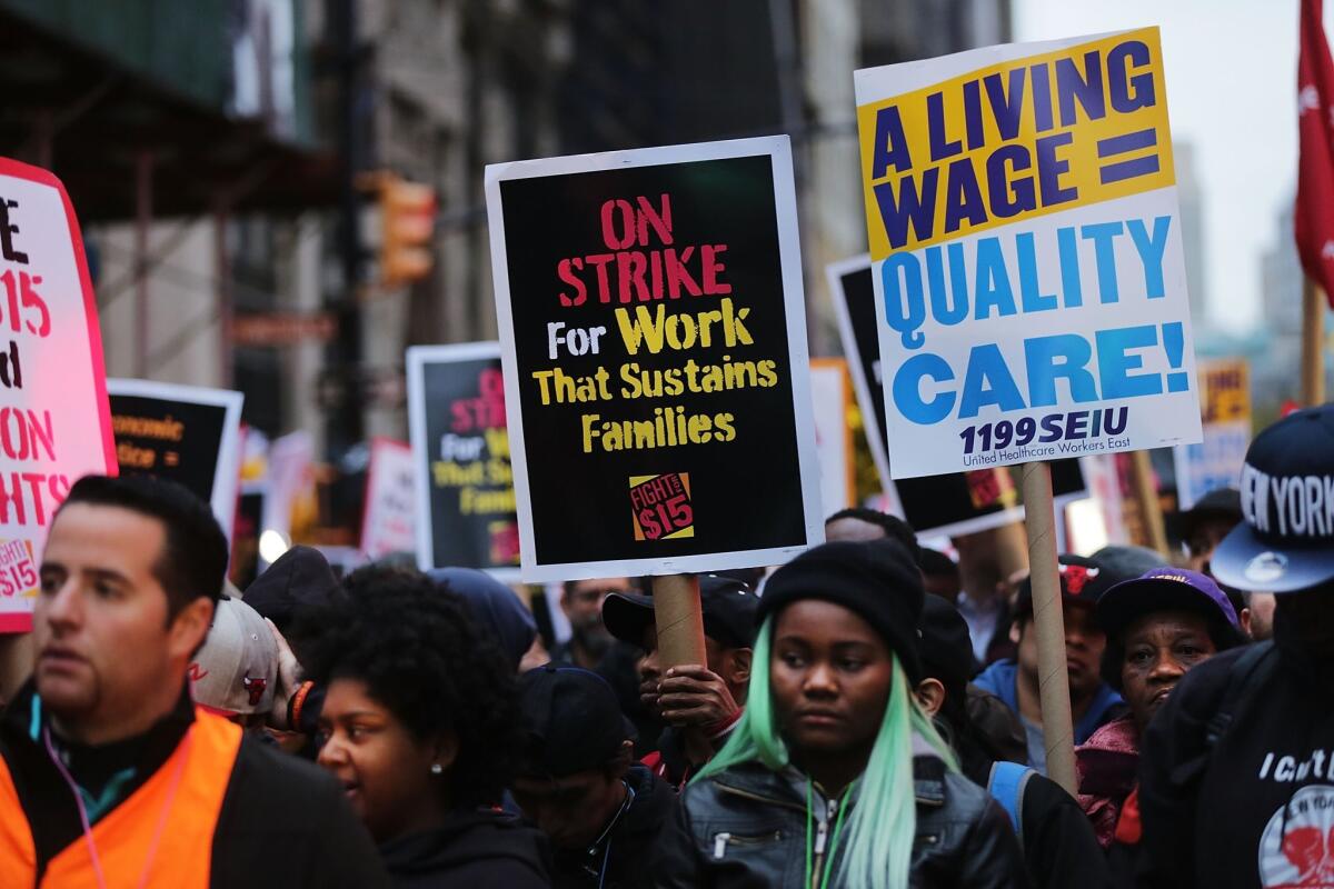 Low wage workers and supporters protest for a $15 an hour minimum wage on November 10, 2015 in New York, United States.
