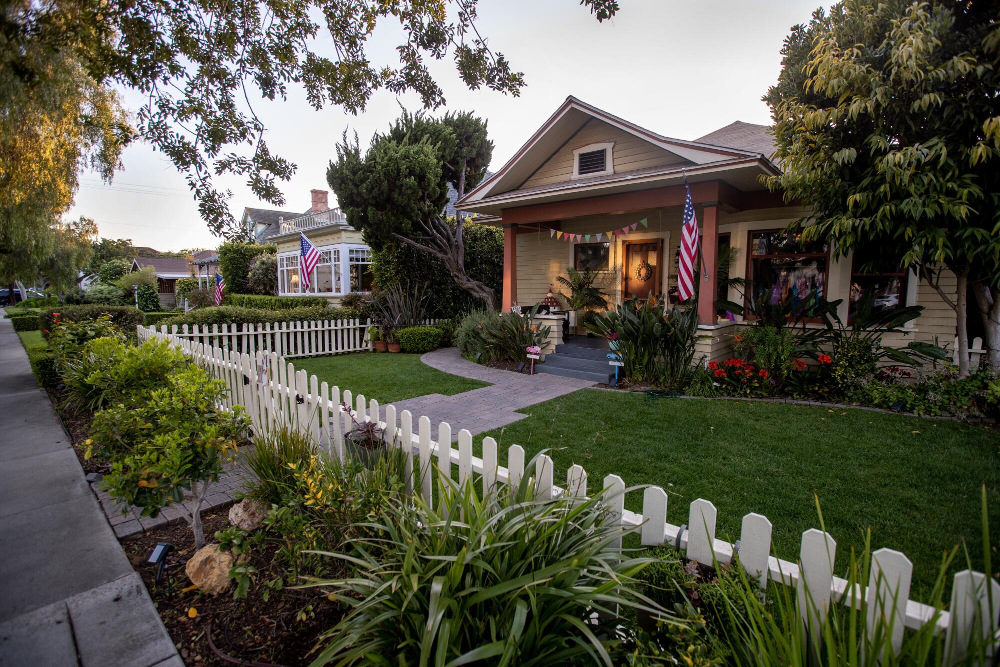 The sun sets over houses on B Avenue in Coronado