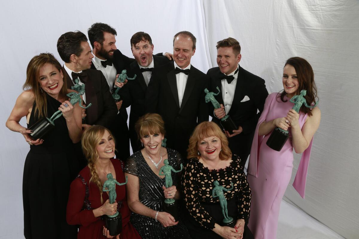 Cast members from "Downton Abbey," winners for performance by an ensemble in a drama series, in the Los Angeles Times photo booth at the 22nd Annual Screen Actors Guild Awards.