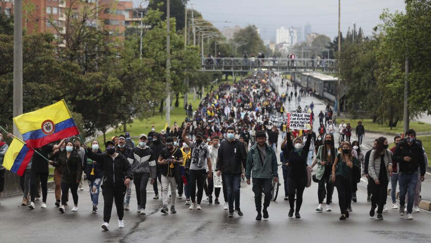 University students march during a national strike against tax reform in Bogota, Colombia, Monday, May 3, 2021. Colombia's President Ivan Duque withdrew the government-proposed tax reform on Sunday. (AP Photo/Fernando Vergara)