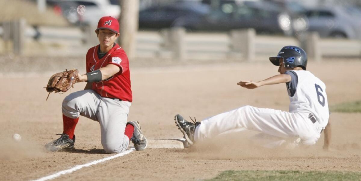 Andy's of Crescenta Valley third baseman Will Rees, left, attempts to make a play on a ball, while Glendale Jewel City/Jewish War Veterans Bears runner Matthew Bajanian slides in safely.