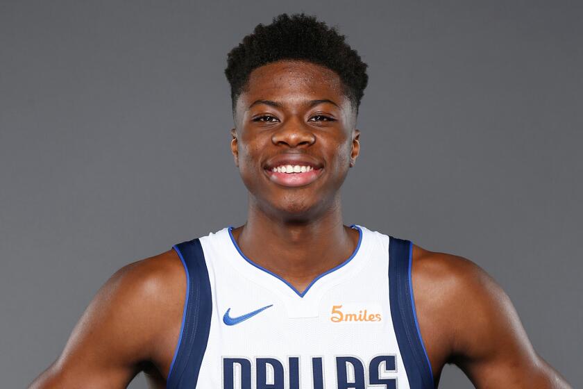 FILE - In this Sept. 21, 2018, file photo, Dallas Mavericks forward Kostas Antetokounmpo, of Greece, poses for a photo during the NBA basketball team's media day in Dallas. The Los Angeles Lakers have been awarded the rights to Kostas Antetokounmpo on a waiver claim. The Lakers announced the move Monday, July 22, 2019, to acquire the 21-year-old brother of Milwaukee Bucks superstar Giannis Antetokounmpo. (AP Photo/Jim Cowsert, File)