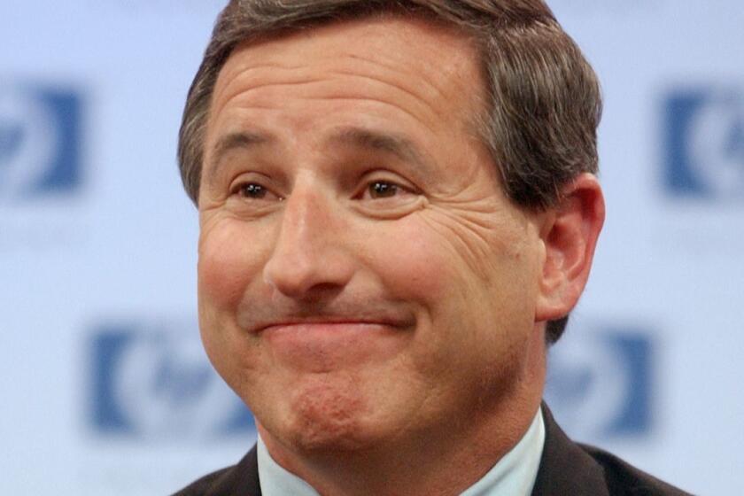 **FILE** New Hewlett Packard Company chief executive Mark Hurd smiles during a news conference at HP headquarters in Palo Alto, Calif. in this March 30, 2005 file photo. Hewlett-Packard Co.'s decision to appoint Hurd as chairman next year contradicts the company's current corporate guidelines that mandates splitting the jobs between two people, and has rekindled Wall Street debate about consolidating too much power in one executive. (AP Photo/Paul Sakuma, File) ORG XMIT: NYBZ107