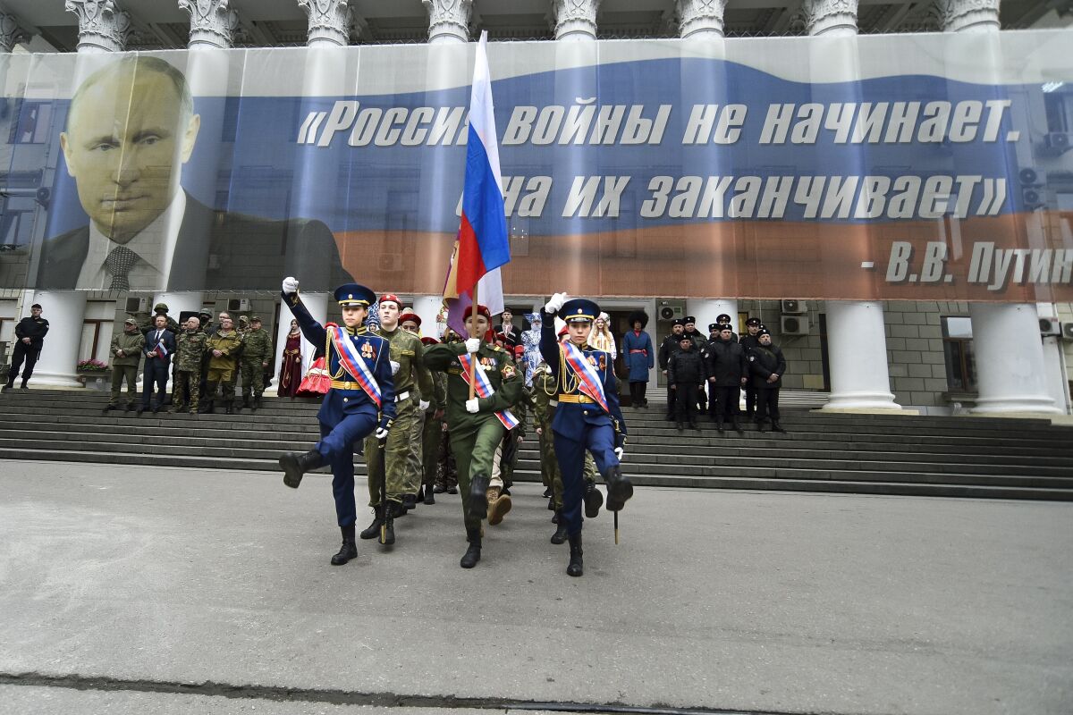 Youths taking part in celebration of anniversary of Russia's annexation of Crimea