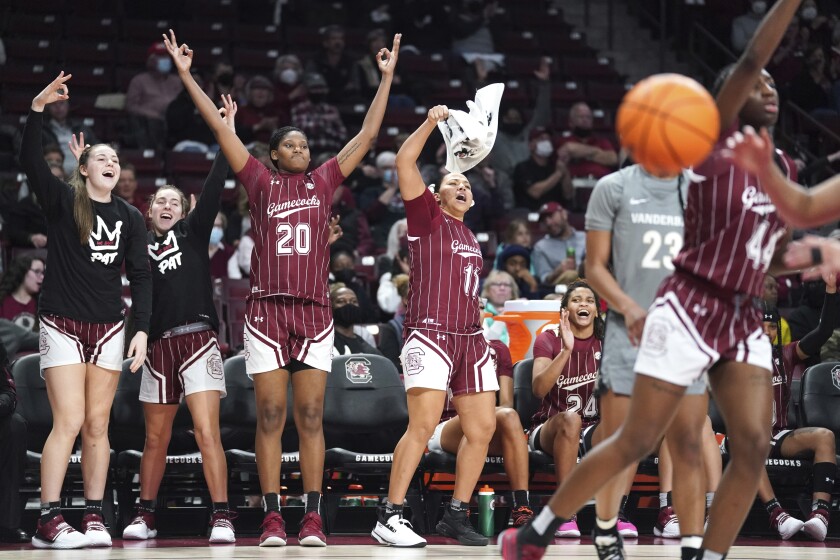 From left to right, South Carolina forward Elysa Wesolek, Olivia Thompson, Sania Feagin (20), Destiny Littleton (11) and LeLe Grissett (24) celebrate a three-point basket during the second half of an NCAA college basketball game against Vanderbilt, Monday, Jan. 24, 2022, in Columbia, S.C. (AP Photo/Sean Rayford)
