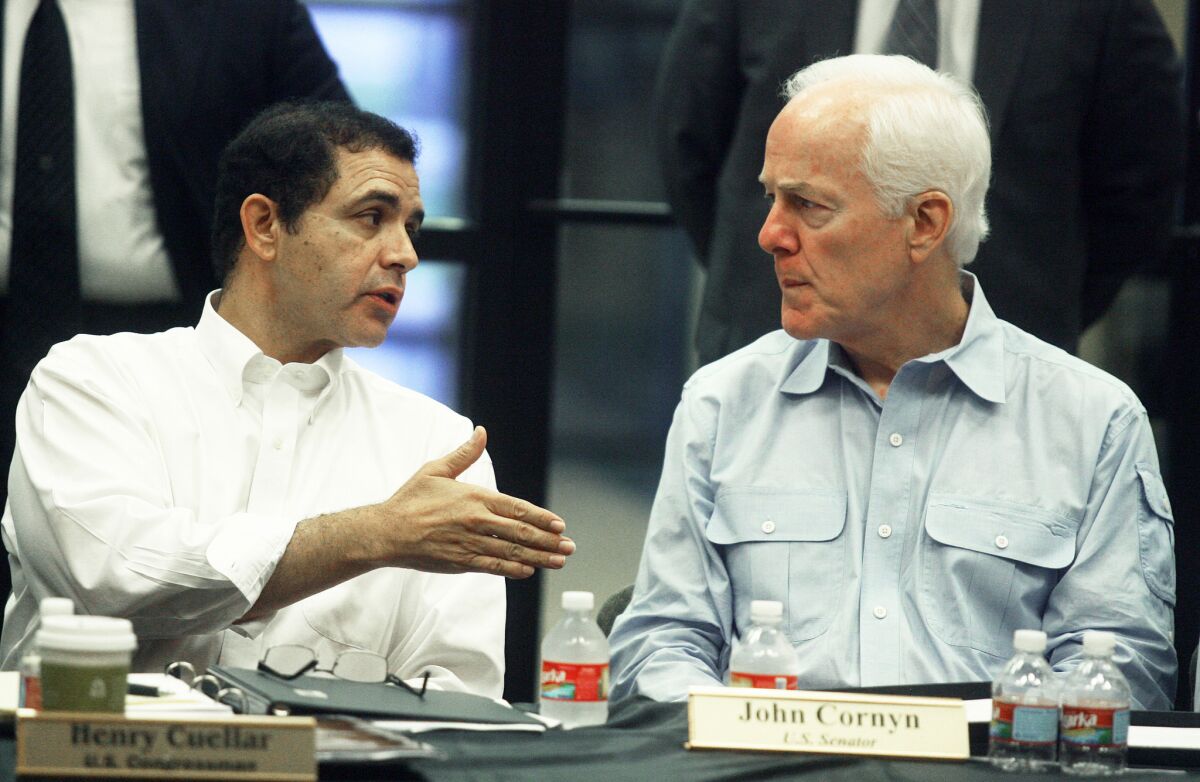 Sen. John Cornyn, right, and Rep. Henry Cuellar discuss the Helping Unaccompanied Minors and Alleviating National Emergency Act in Mission, Texas.