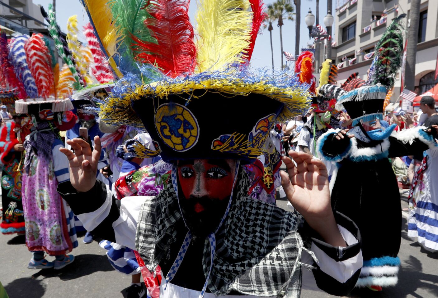 Traditional Mexican dancers perform on Main Street during the annual Independence Day Parade in Huntington Beach.