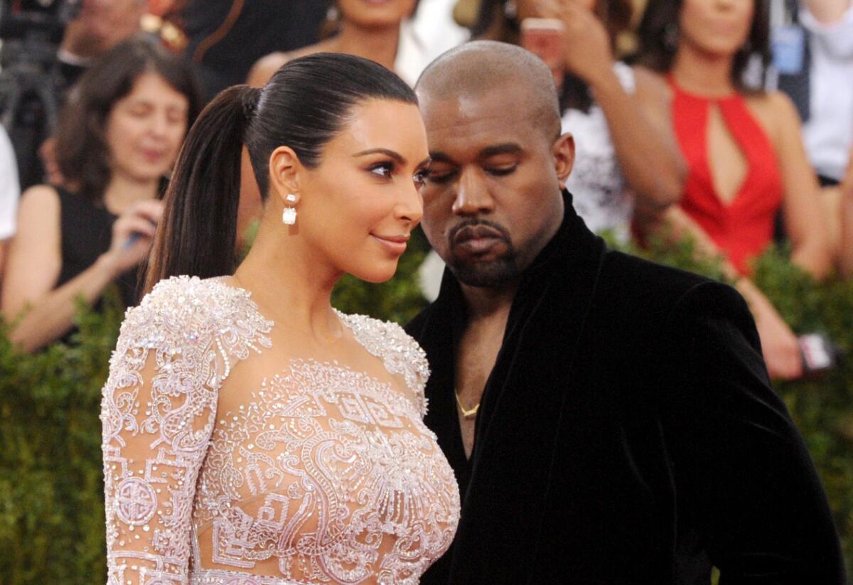Kim Kardashian, left, and Kanye West arrive at the Metropolitan Museum of Art's Costume Institute benefit gala in New York.