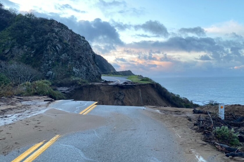 In this photo provided by Caltrans, a section of Highway 1 is collapsed following a heavy rainstorm near Big Sur, Calif., on Friday, Jan. 29, 2021. A drenching storm that brought California much-needed rain in what had been a dry winter wound down Friday after washing out Highway 1 near Big Sur, burying the Sierra Nevada in snow and causing muddy flows from slopes burned bare by wildfires. (Caltrans via AP)