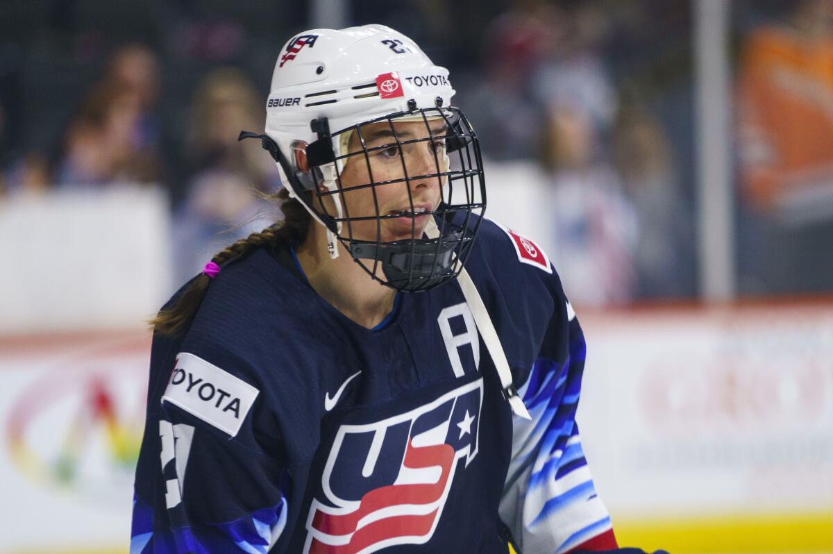 FILE - United States' Hilary Knight looks on before a women's hockey game against the Canada, Oct. 22, 2021, in Allentown, Pa. Cammi Granato had never forgotten the young girl she lent her stick and gloves to during one of the former U.S. Olympian’s first hockey camps in Chicago in the late 1990s. It was not until years later when Granato discovered that girl just happened to be Knight. (AP Photo/Chris Szagola, File)
