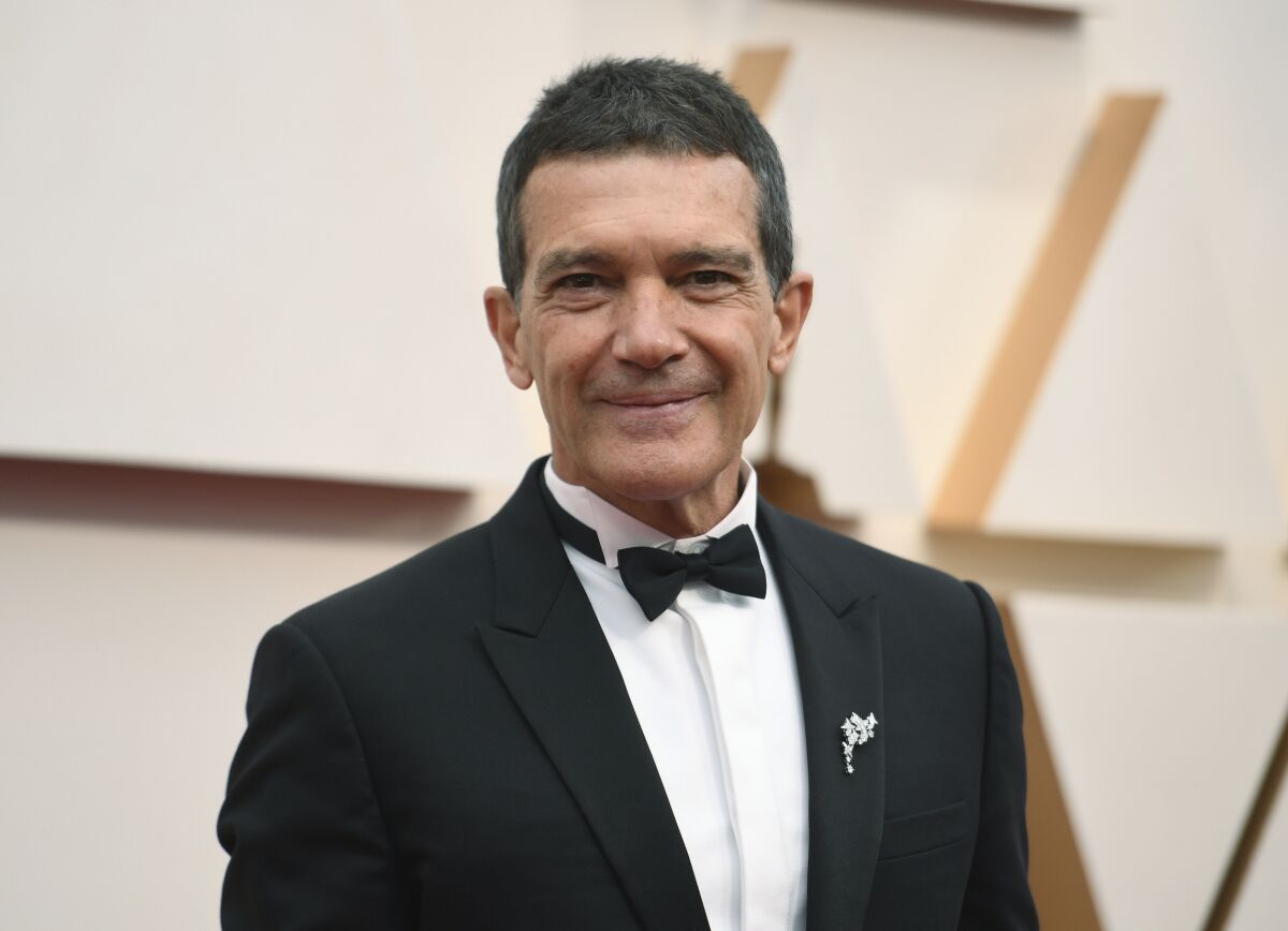 FILE - Antonio Banderas arrives at the Oscars in Los Angeles on Feb. 9, 2020. Banderas says he’s tested positive for COVID-19 and is celebrating his 60th birthday in quarantine. The Spanish actor announced his positive test on Instagram on Monday. (Photo by Richard Shotwell/Invision/AP, File)