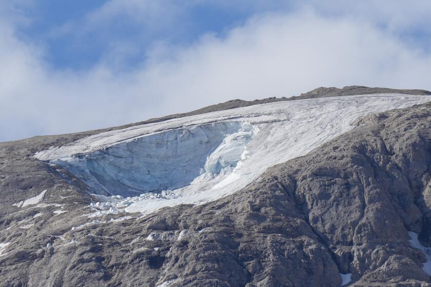 A view of the Punta Rocca glacier near Canazei, in the Italian Alps in northern Italy, Tuesday, July 5, 2022, two day after a huge chunk of the glacier broke loose, sending an avalanche of ice, snow, and rocks onto hikers. (AP Photo/Luca Bruno)