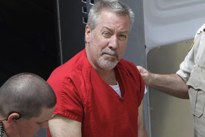 Former Bolingbrook, Ill., Police Sgt. Drew Peterson arrives at court in 2009 for his arraignment in the death of his third wife.