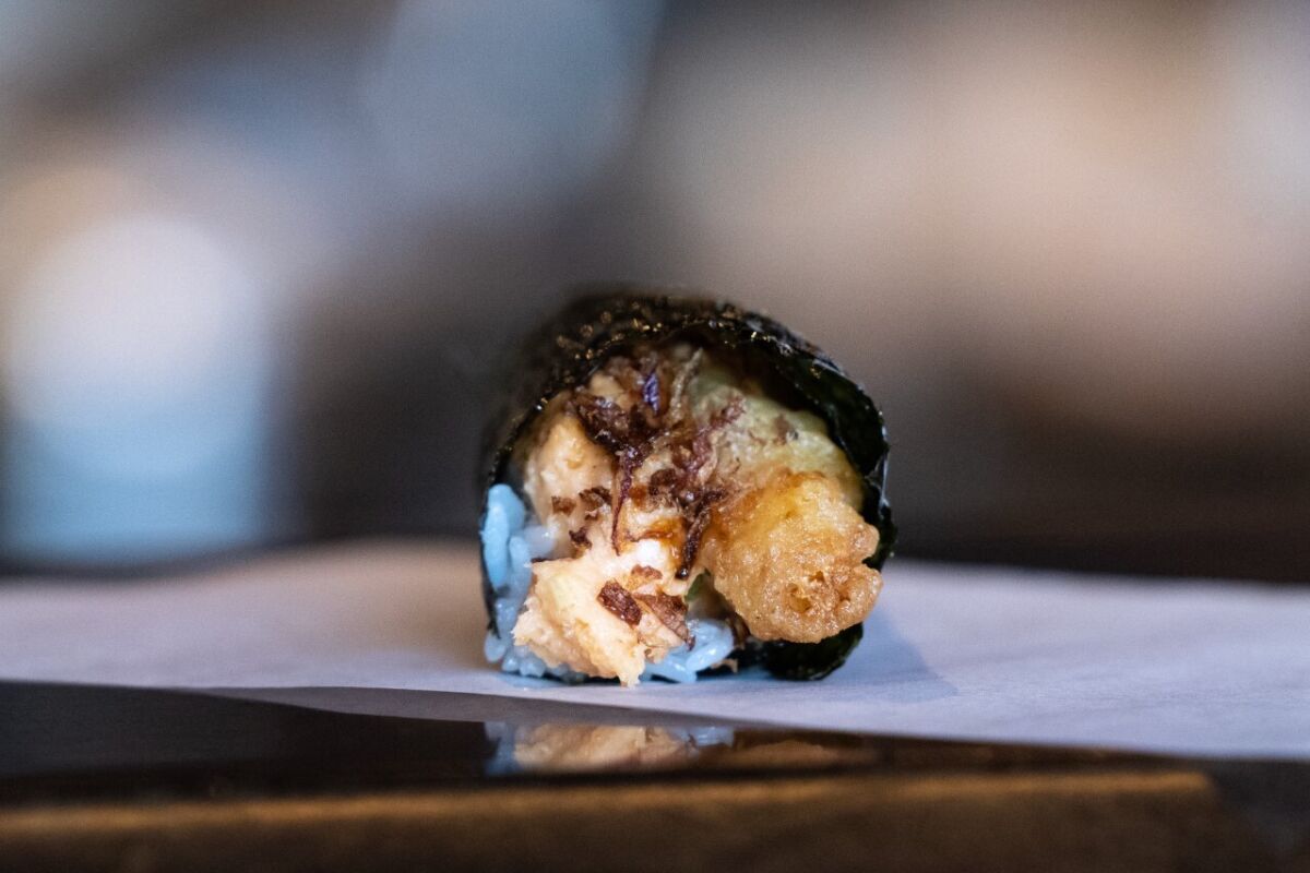 A hand roll with shrimp tempura and spicy sauce from Yunomi.